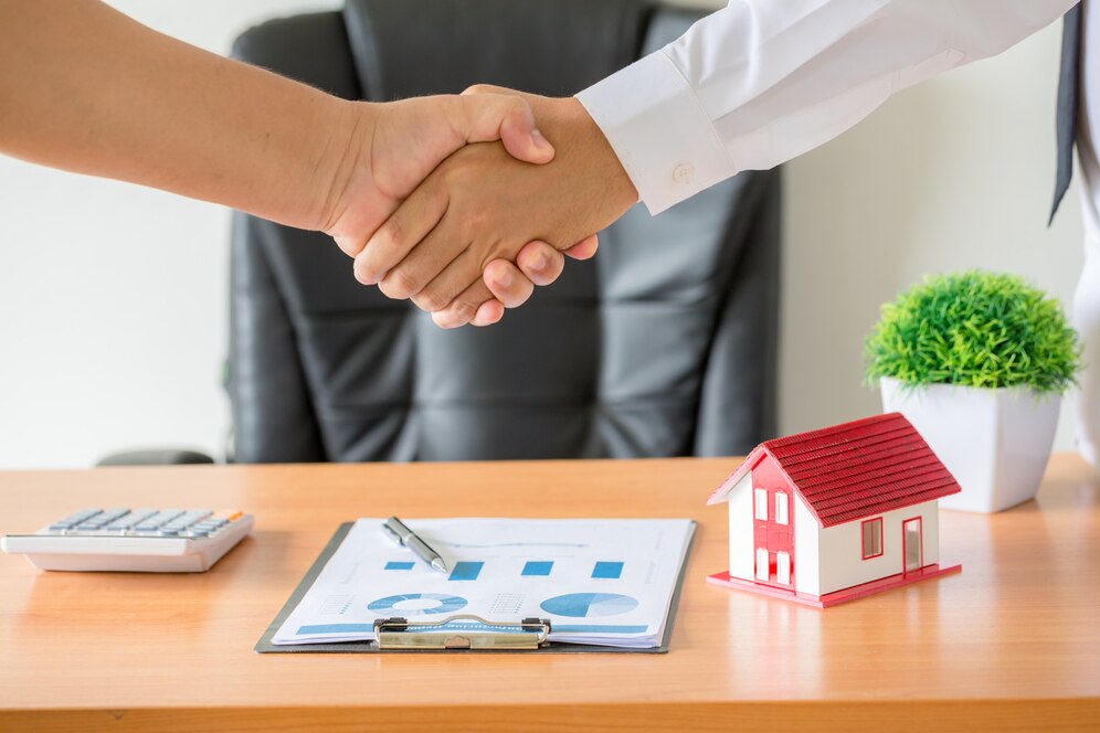 hands-agent-client-shaking-hands-after-signed-contract-buy-new-apartment_1150-14836
